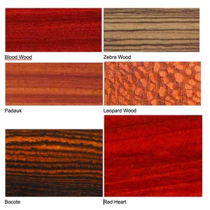 May include: A collection of wood samples showcasing various grain patterns and colors. Includes Blood Wood, Zebra Wood, Padauk, Leopard Wood, Bocote, and Red Heart. Each sample displays unique textures and hues, ranging from deep reds to striped patterns.