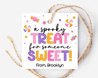 May include: A white square gift tag with the text "a spooky TREAT for someone SWEET!" in colorful letters. The tag is decorated with candy and stars. The tag is tied with a natural twine string. From, Brooklyn.