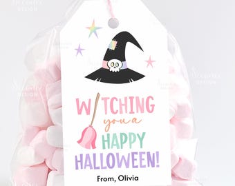 May include: A clear cellophane bag filled with pink and white marshmallows, tied with a pink ribbon. A white tag features a witch hat with a skull, a broom, and the text "Witching you a Happy Halloween!" with the name "Olivia".