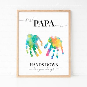 May include: A printable art print with colorful handprints in a heart shape. The text reads "best PAPA ever HANDS DOWN love you always".