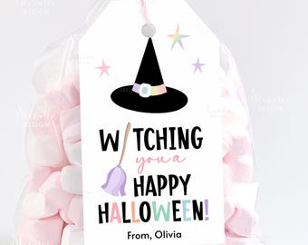 May include: A clear cellophane bag filled with pink and white marshmallows. A white tag with a black witch hat, stars, and the text "Watching you a Happy Halloween! From, Olivia" is attached to the bag with a pink ribbon.