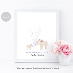 May include: A printable baby shower guest book featuring two watercolor elephants with floral accents. The elephants are in shades of purple, pink, and yellow. The text "SHOWERED WITH LOVE Baby Skyler" is printed below the elephants.