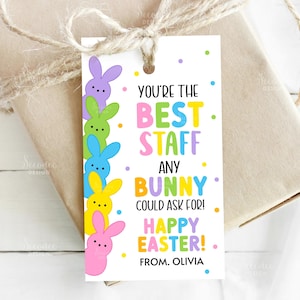 May include: A colorful Easter gift tag with a bunny theme. The tag reads "You're the Best Staff Any Bunny Could Ask For! Happy Easter!" and features a row of pastel-colored bunny illustrations. The tag is tied to a wrapped gift.