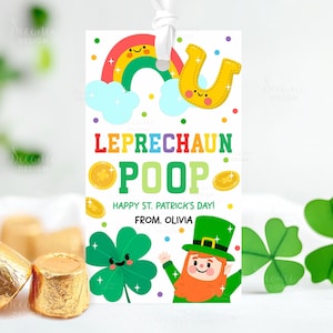 May include: A St. Patrick's Day gift tag with a rainbow, horseshoe, and gold coins. The tag reads "Leprechaun Poop" and "Happy St. Patrick's Day!" with a leprechaun illustration and the name "Olivia". The tag is white with a white ribbon.