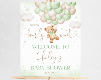 May include: A green and brown baby shower welcome sign with a teddy bear holding balloons. The sign says "We can barely wait" and "Welcome to Hailey's Baby Shower 27.12.2094".