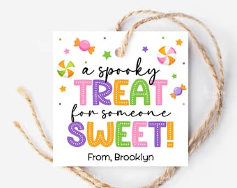 May include: A white square gift tag with the text "a spooky TREAT for someone SWEET!" in colorful letters. The tag is decorated with candy and stars, and has a twine string attached.