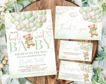 May include: A green and brown baby shower invitation with a teddy bear holding balloons. The invitation says "We can barely wait baby" and includes the name Charlotte Smith. The invitation also includes the date, time, and location of the baby shower.