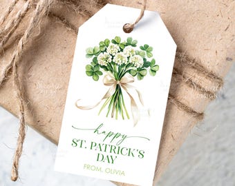 May include: A white gift tag with a watercolor illustration of a bouquet of shamrocks and white flowers tied with a beige ribbon. The tag reads "happy ST. PATRICK'S DAY" in green script, with a personalized name below.