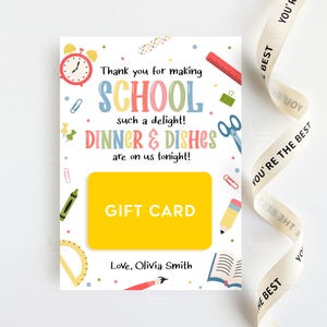 May include: A gift card with a yellow center and the words "GIFT CARD" in white. The card is decorated with school-themed graphics, including a clock, scissors, and a pencil. Text on the card reads "Thank you for making SCHOOL such a delight! DINNER & DISHES are on us tonight!"