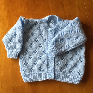 Pretty hand knitted baby cardigan available in choice of colours. Suitable for both boys and girls. image 10