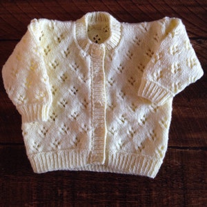 Pretty hand knitted baby cardigan available in choice of colours. Suitable for both boys and girls. image 2