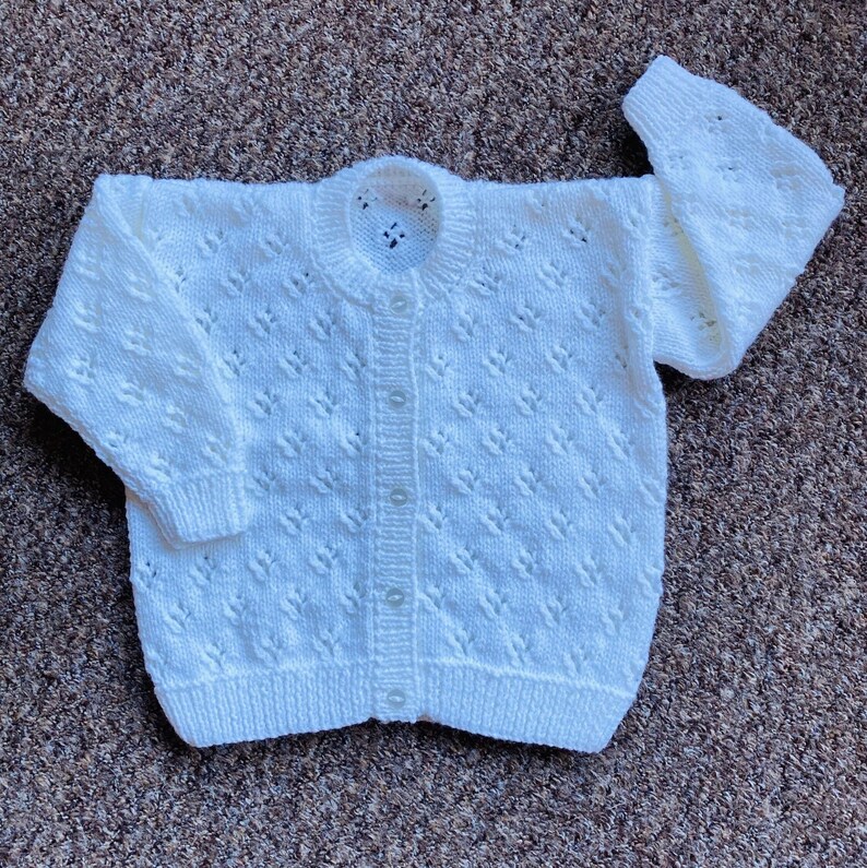 Pretty hand knitted baby cardigan available in choice of colours. Suitable for both boys and girls. image 1