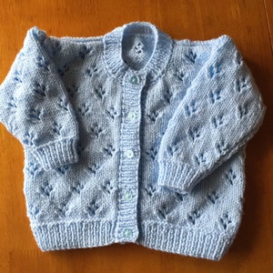 Pretty hand knitted baby cardigan available in choice of colours. Suitable for both boys and girls. image 9