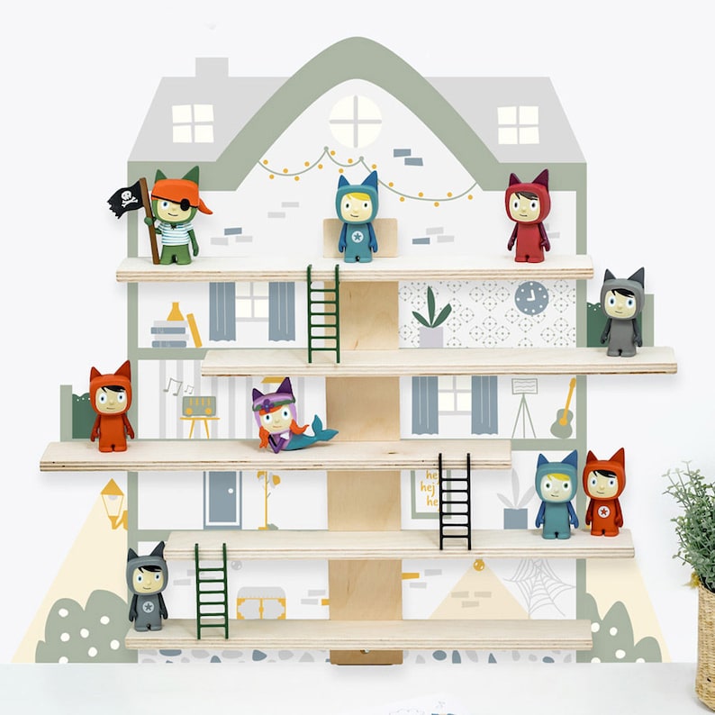 May include: A wooden shelf unit with a house-shaped design, featuring a variety of colorful figurines with animal faces. The figurines are arranged on the shelves, with some holding accessories like a pirate flag or a musical instrument. The shelves are decorated with a light green and white wallpaper pattern.