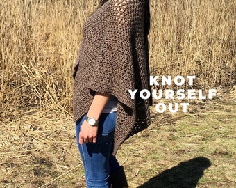 May include: A woman wearing a brown crochet poncho, blue jeans, brown boots, and sunglasses. The text "Knot Yourself Out" is superimposed on the image.