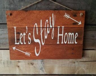 Let's stay home, rustic handpainted sign on reclaimed wood.