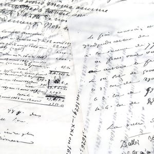 May include: Close-up of aged handwritten documents with faded ink. The papers feature cursive script, numbers, and calculations. The documents appear to be historical records, possibly accounting ledgers or personal correspondence, with visible wear and tear.