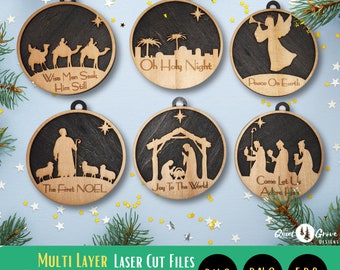 May include: Six round wooden Christmas ornaments with laser cut designs. The ornaments feature various Christmas themes, including "Oh Holy Night", "Wise Men Seek Him Still", "Peace On Earth", "The First Noel", "Joy To The World", and "Come Let Us Adore Him".