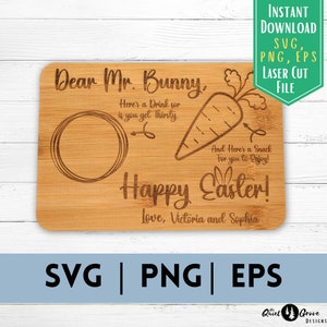 May include: A wooden cutting board with a laser-engraved design featuring a bunny, carrot, and the text "Dear Mr. Bunny, Here's a Drink for if you get Thirsty. And Here's a Snack for you to Enjoy! Happy Easter! Love, Victoria and Sophia".