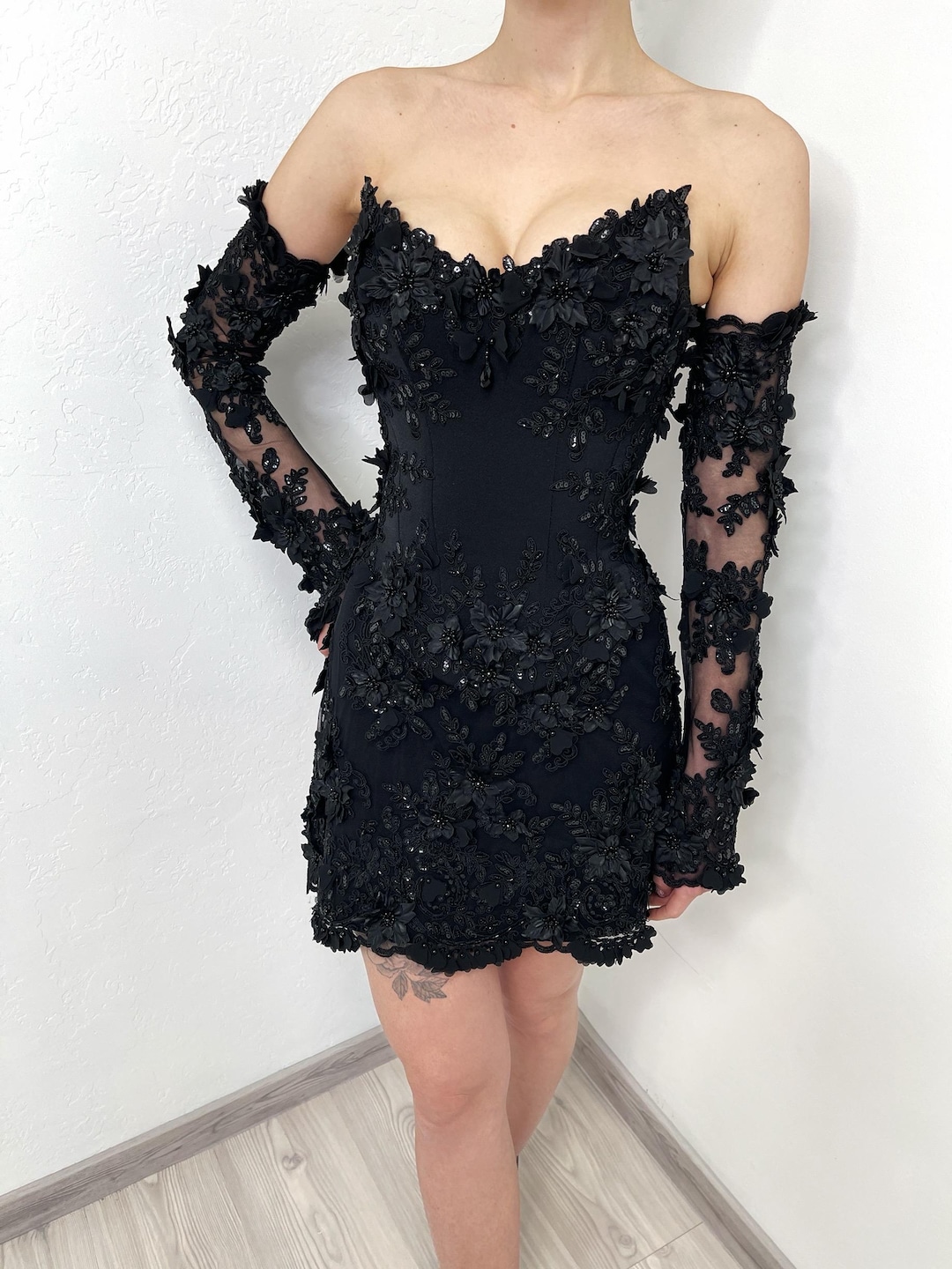 floral-appliqu corset mini dress in black Corset floral appliqu mini black dress with removable straps. Accept  custom orders. #dress #gown #fashion #prom #wedding #eveningdress  #partyoutfits #elegantdresses #minidress #hautecouture #couturefashion  #fashionweek #vintage #partydress