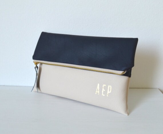 navy and cream clutch bag