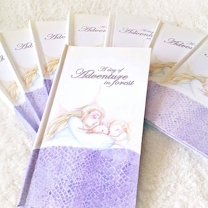 May include: A stack of purple and white paperback books with the title "A Day of Adventure in Forest" on the front cover. The cover features an illustration of a woman and a child.