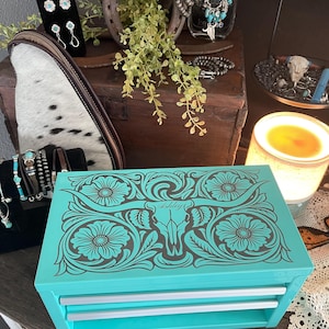 May include: A set of three ceramic mugs with a speckled, matte finish in light blue, cream, and grey. The mugs have a simple, modern design and a comfortable handle.