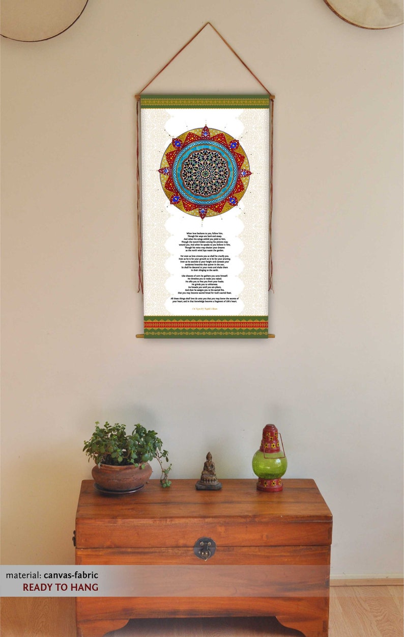 May include: A canvas wall hanging with a colorful mandala design and a poem about love and life. The text reads "When love besieges you, follow her..." The hanging is ready to hang and is made of canvas fabric.