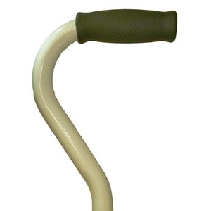 May include: A white cane with a curved handle and a green rubber grip. The cane is designed to provide support and stability for walking.