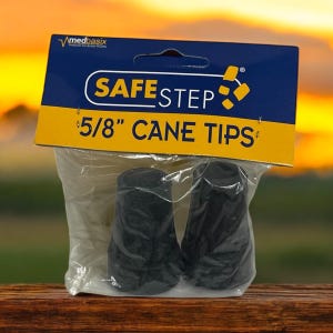 May include: A package of Safe Step 5/8" cane tips. The package has a blue and yellow label with the brand name and product description. Two black cane tips are visible inside a clear plastic bag.