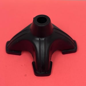 May include: Black rubber cane tip with a three-pronged base for stability.