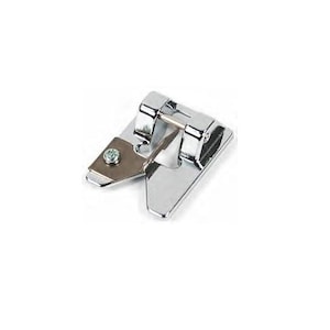 May include: A silver sewing machine foot with a small metal screw. The foot is designed for sewing a rolled hem.