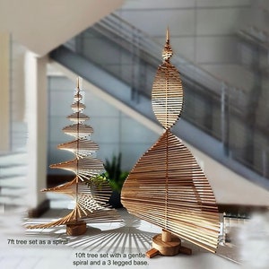 May include: Two wooden Christmas trees, one 7 feet tall and the other 10 feet tall. The smaller tree is a spiral design, while the larger tree has a gentle spiral and a three-legged base.