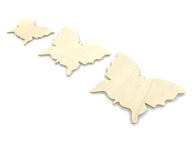 May include: Three unfinished wooden butterfly shapes in various sizes. The butterflies are arranged in a row from smallest to largest.