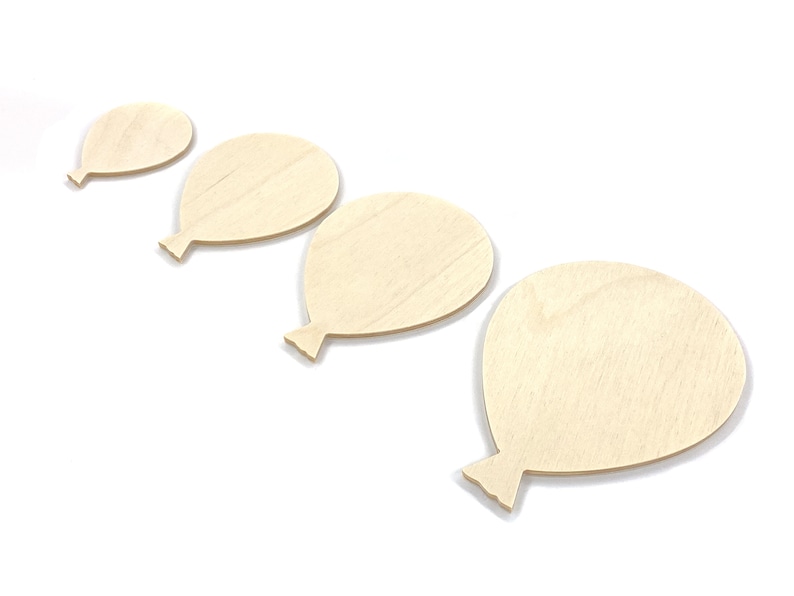 May include: Four unfinished wooden balloon shapes of varying sizes. The balloons are arranged in a row from smallest to largest.