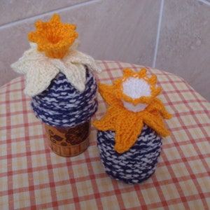 Pair Of Hand Knitted Egg Cosies With Daffodils Yellow And Orange