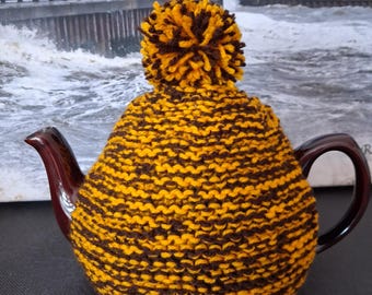 Small Tea Cosy Hand Knitted In Yellow And Brown Yarn