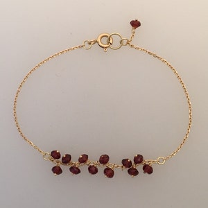 18k gold chain bracelet with garnet