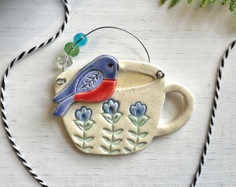 handmade blue bird on a teacup beaded ceramic ornament