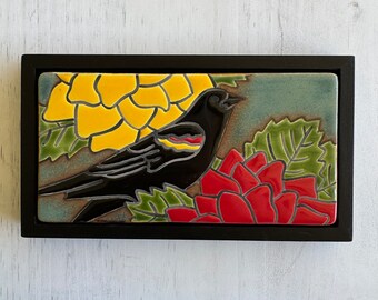 Red winged blackbird in my garden  handmade and hand glazed ceramic framed art tile