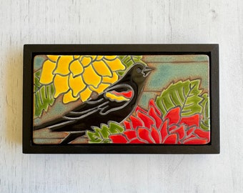 Red winged blackbird in my garden  handmade and hand glazed ceramic framed art tile