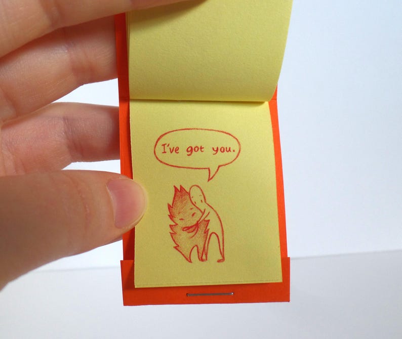 May include: A small orange and yellow book with the text "I've got you." and a red illustration of two figures hugging.