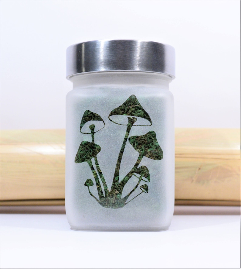 Twisted420Glass Perfectly Magical Mushroom design etched glass stash jar featuring a psychedelic mushroom design, airtight seal and odor-proof twist tight seal.