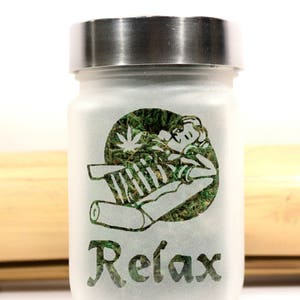 Unwind in style with the Time to Relax Deep Etched Glass Stash Jar by Twisted420Glass - the ultimate airtight and smell-proof container for storing your favorite herbs. Perfect for gifting and adding to your heady collection.