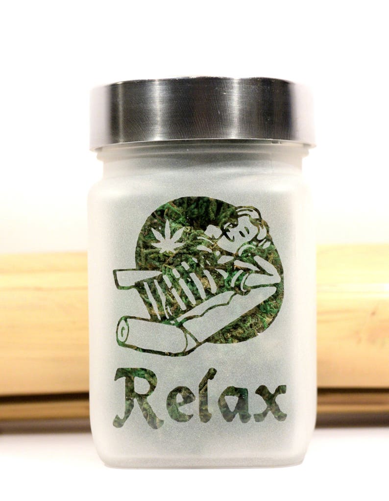 Unwind in style with the Time to Relax Deep Etched Glass Stash Jar by Twisted420Glass - the ultimate airtight and smell-proof container for storing your favorite herbs. Perfect for gifting and adding to your heady collection.