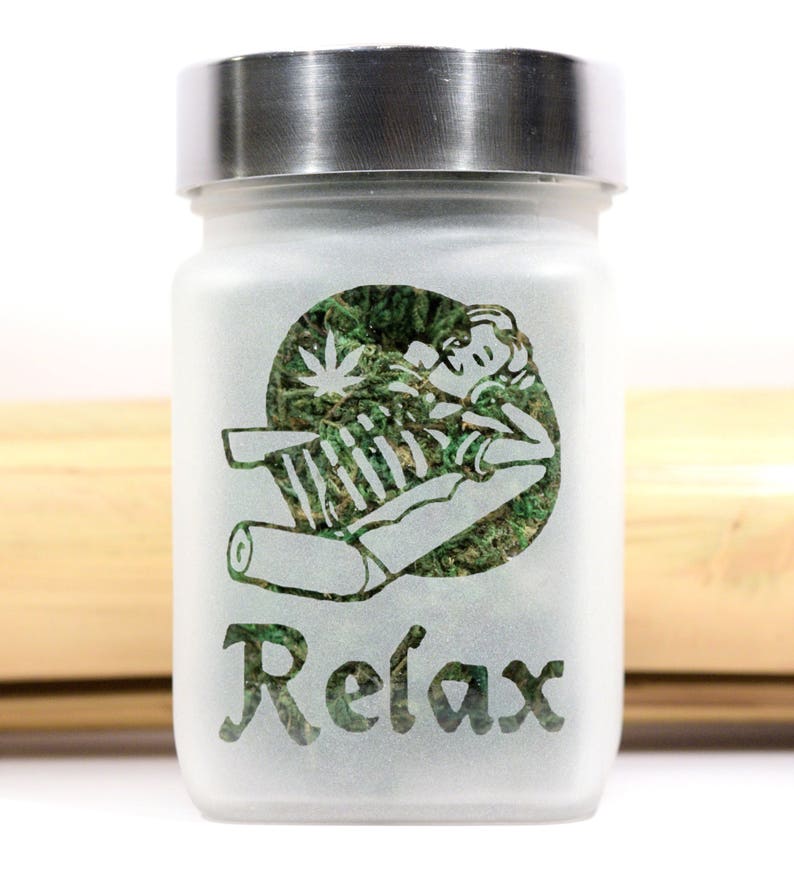 Unwind in style with the Time to Relax Deep Etched Glass Stash Jar by Twisted420Glass - the ultimate airtight and smell-proof container for storing your favorite herbs. Perfect for gifting and adding to your heady collection.