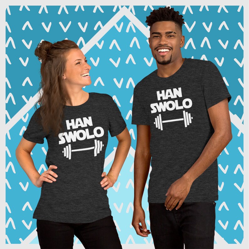 May include: Two people wearing dark grey t-shirts with white text that says "HAN SWOLO" and a white barbell graphic.