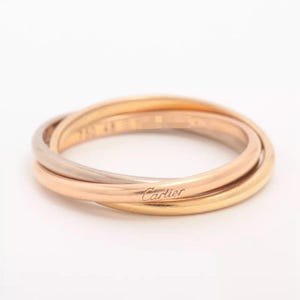 Authentique bague roulante Trinity Thin 18 carats de Cartier