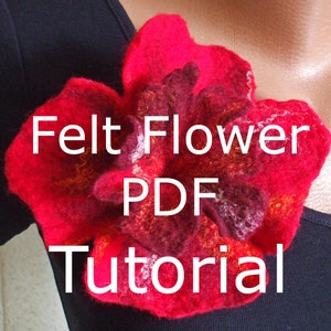 May include: A red felt flower with a white and brown centre. The flower is pinned to a black shirt. The text "Felt Flower PDF Tutorial" is superimposed on the image.
