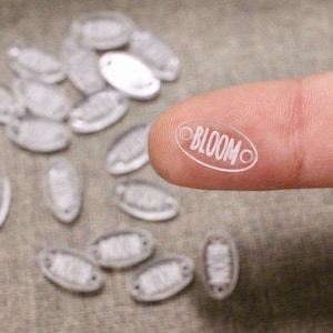 Tiny oval clear acrylic tag for jewelry making with custom logo or text